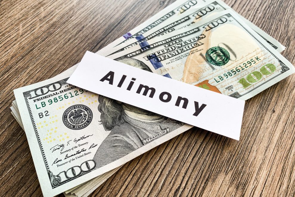 Payments alimony. Pile Dollars with sign alimony and money. Divorce and separation concept