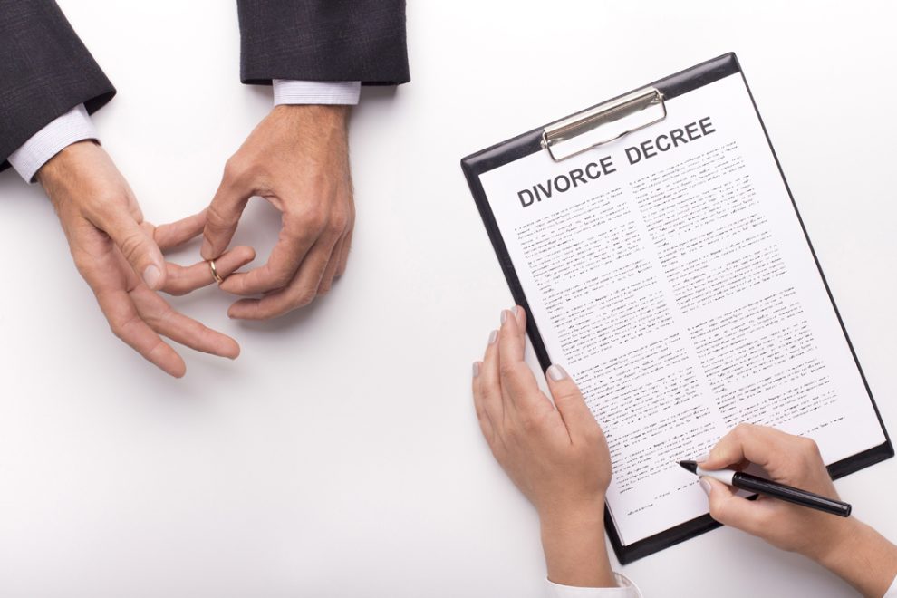 Lawyer draw up divorce decree on planner